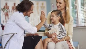 doctor high-fiving happy child