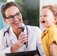 pediatrics doctor helping happy child