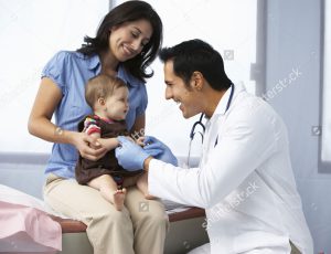 doctor checking on infant patient
