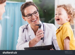 stock-photo-happy-little-boy-after-health-exam-at-doctor-s-office