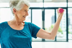 Smiling Patient Lifts Weight