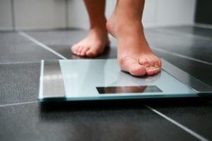 Person stepping on scale