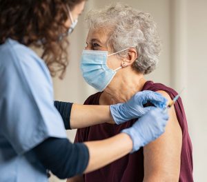Giving Covid Vaccine to Senior Woman