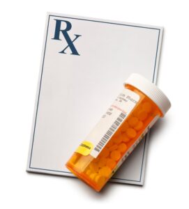 prescription pad and medicine bottle