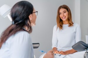 young woman seeking contraception counseling from physician